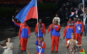 Haiti's flagbearer Linouse Desravine (C)